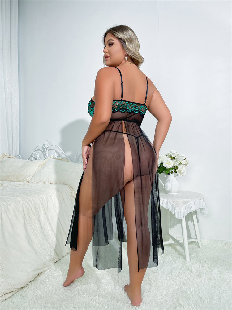Woman wearing a sheer brown dress with a green lace top in a bedroom setting.