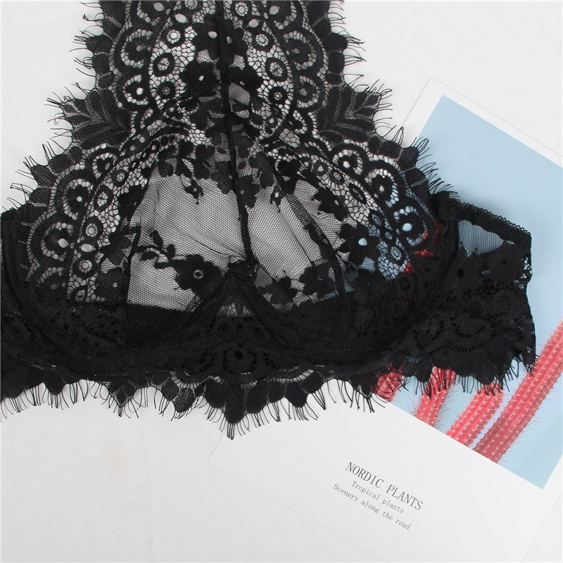 Black lace fabric on a white background with text overlay
