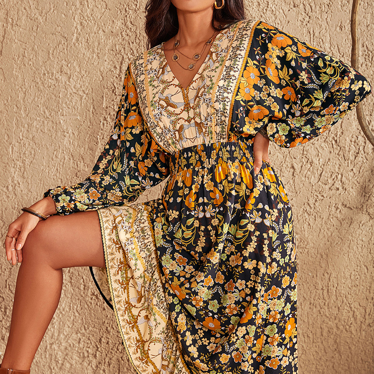 Woman wearing a floral dress against a beige wall