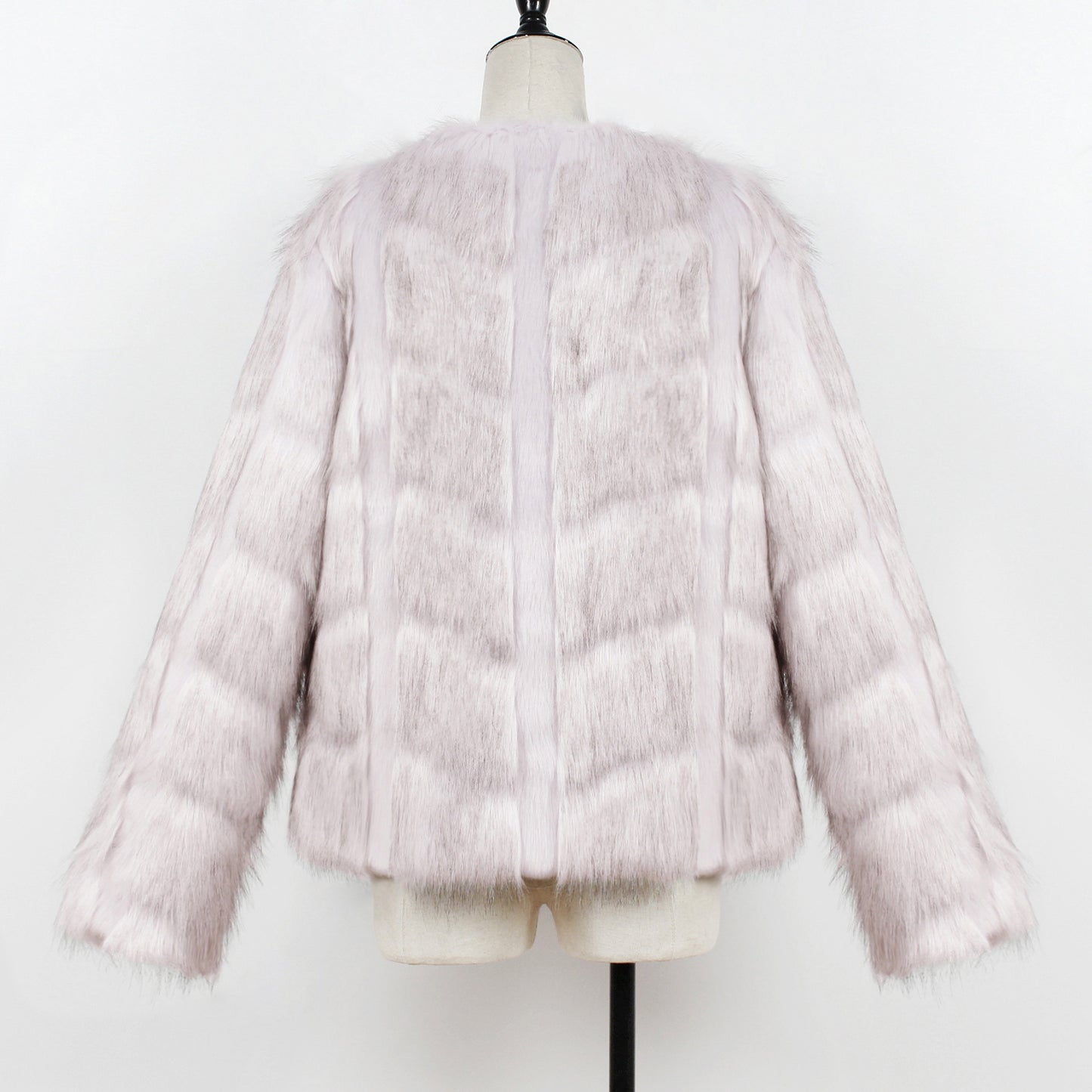 Pink faux fur jacket on a mannequin against a white background