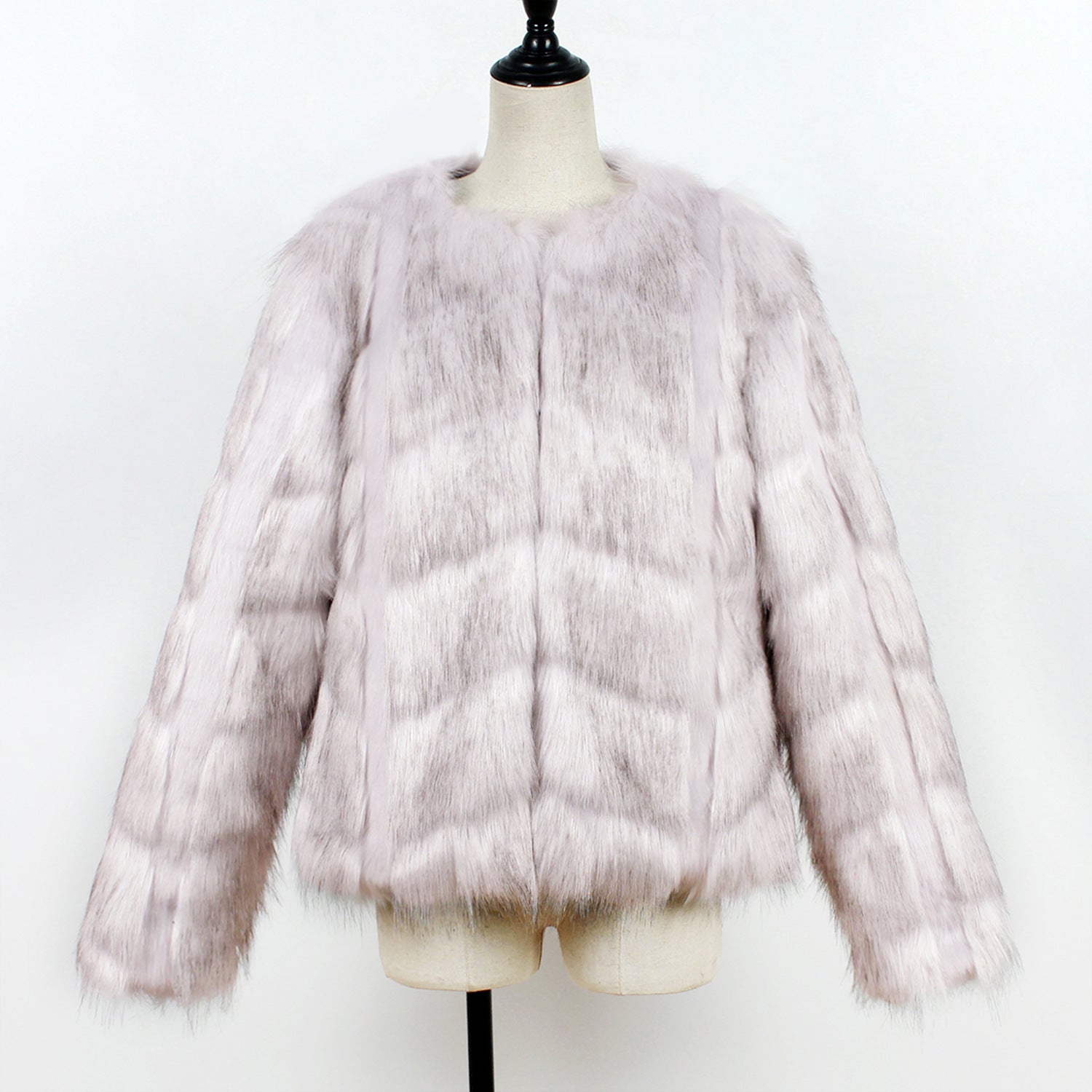 Fur jacket on a mannequin against a white background