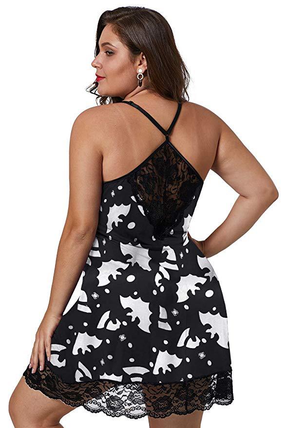 Woman wearing a black lace nightgown with white cat pattern