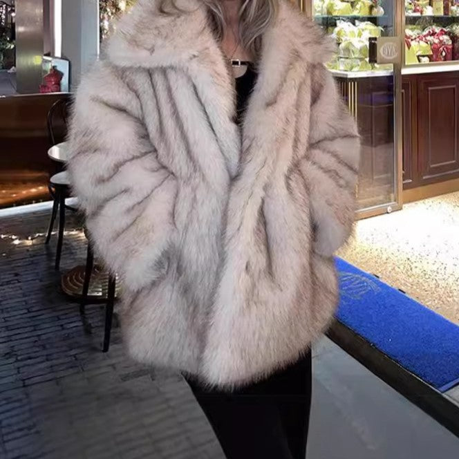 Person wearing a fur coat in an indoor setting with a blurred background