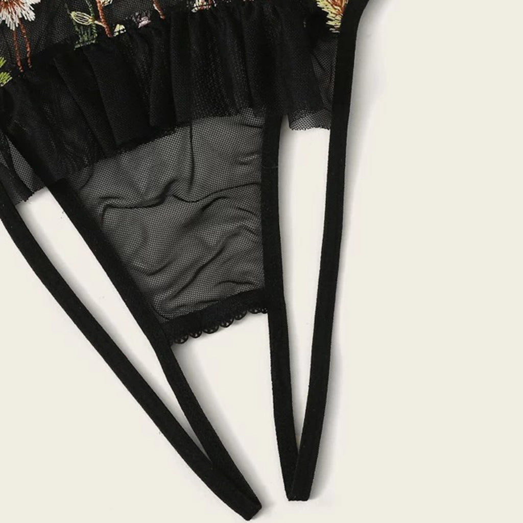 Black tights with floral top on a white background