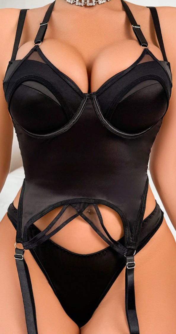 Full view of the matching thong and garter belt in black mesh.