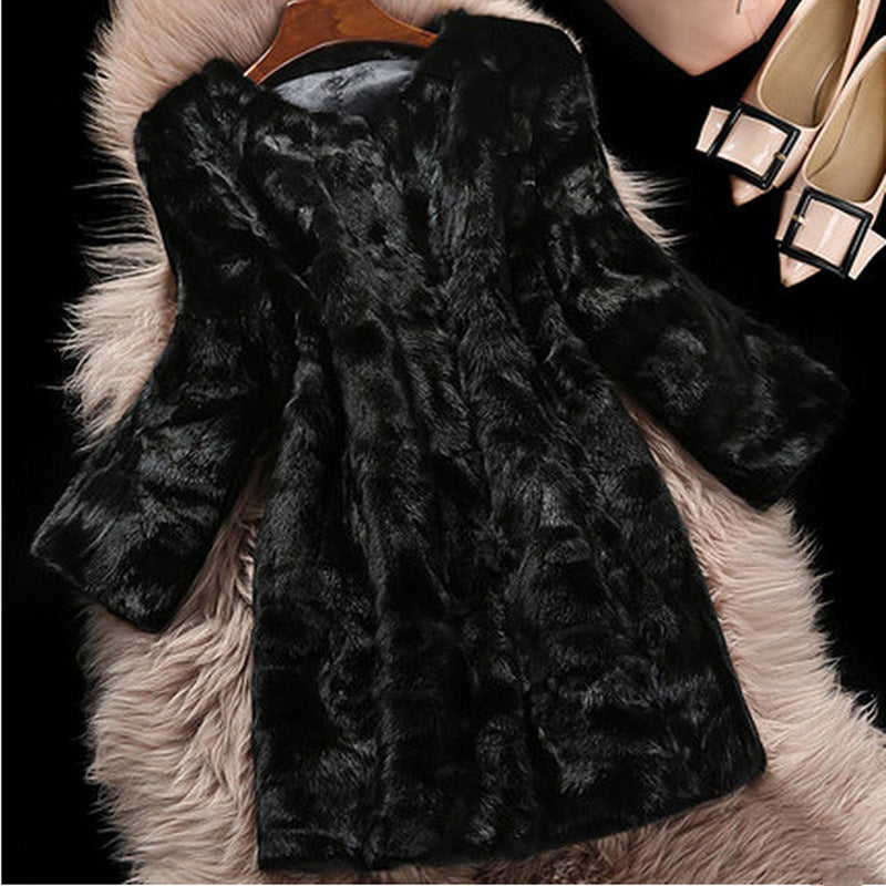 Black fur coat on a hanger with a fluffy surface underneath