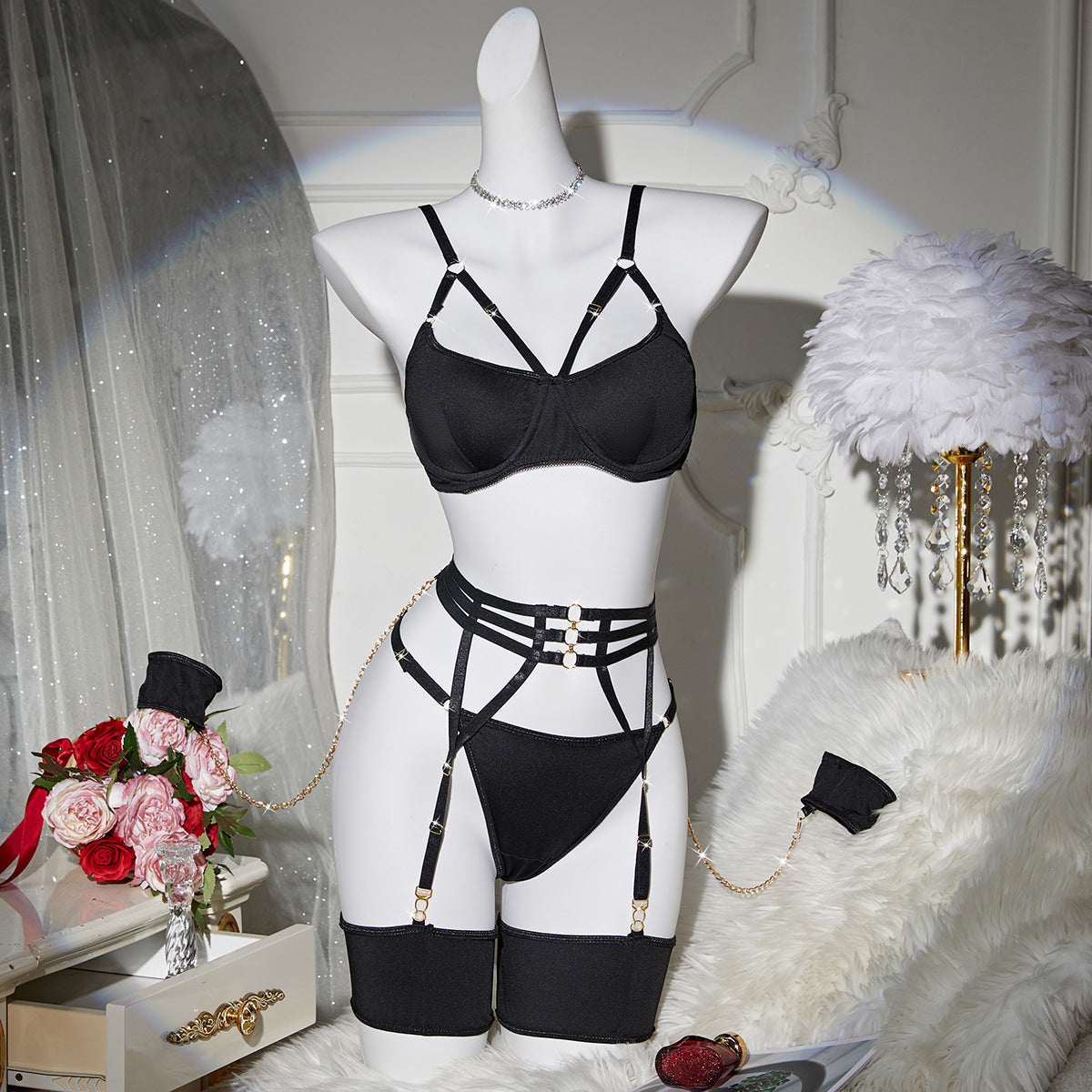 “Close-up of sheer mesh fabric and hollow metal chain accents on women’s lingerie set”