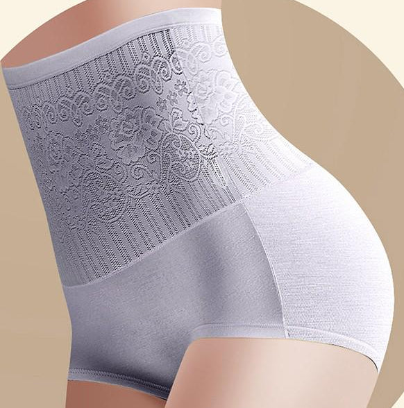 Plus size model wearing high waist body shaper panties for waist and tummy control