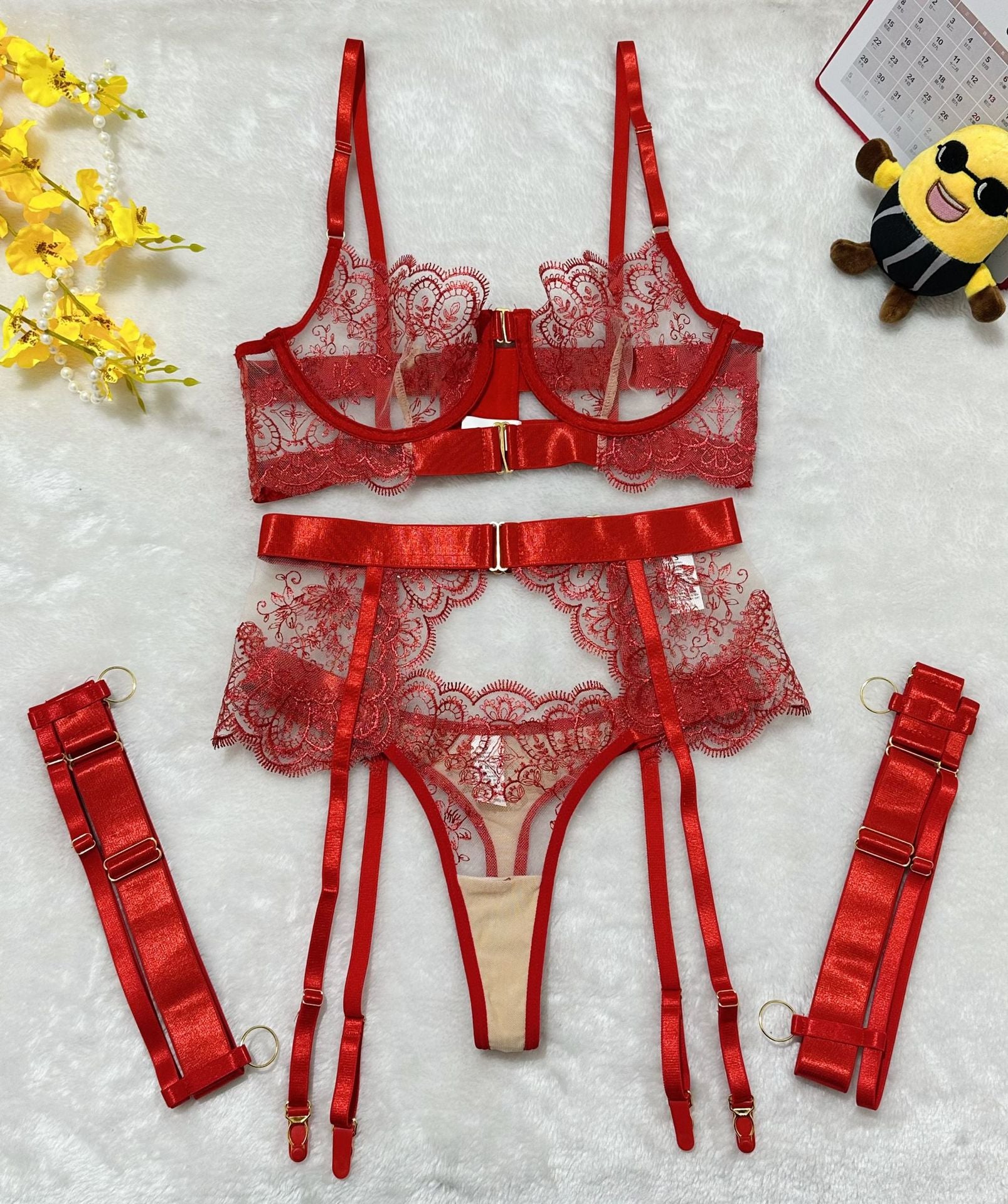 Close-up of floral embroidery and gathered bra detail on plus size lingerie