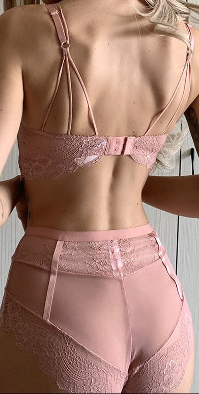 “Back view of pink lace bra set showing adjustable straps and panty design”