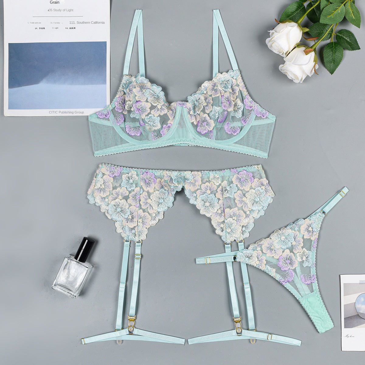floral embroidery and sheer fabric on erotic three-piece lingerie set”
