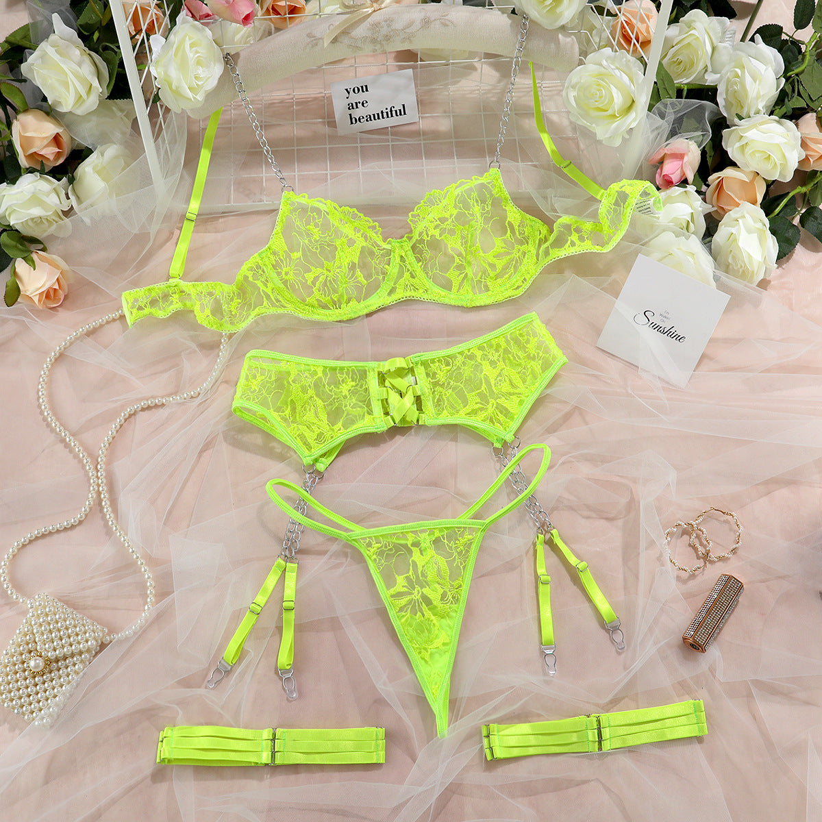 “Close-up of mesh embroidery and hollow cross design on erotic lingerie set”
