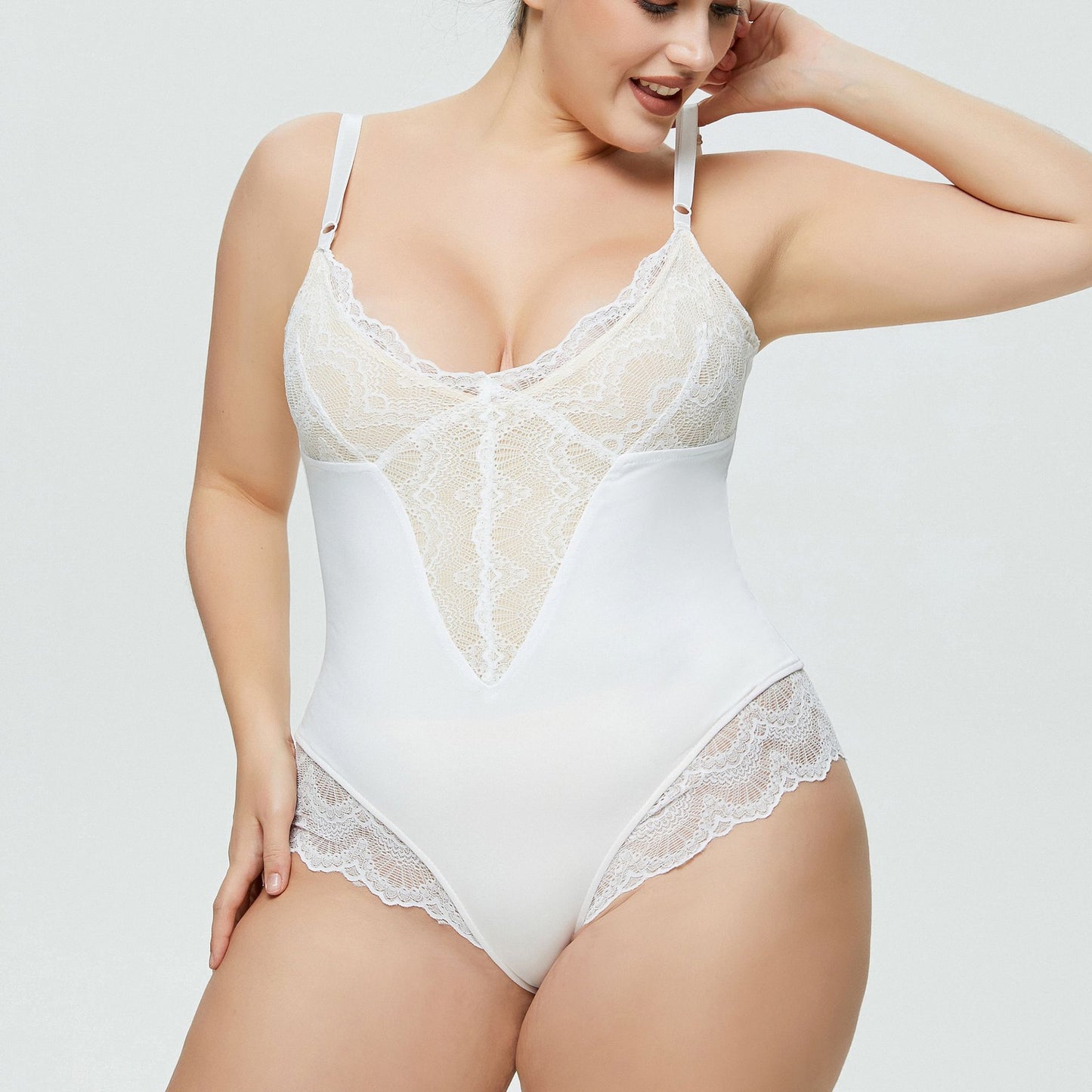 Plus size woman wearing lace splicing sexy strap bodysuit