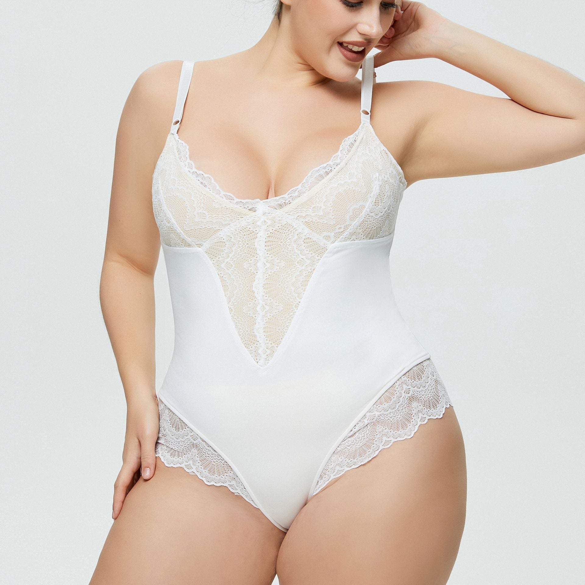 Plus size woman wearing lace splicing sexy strap bodysuit
