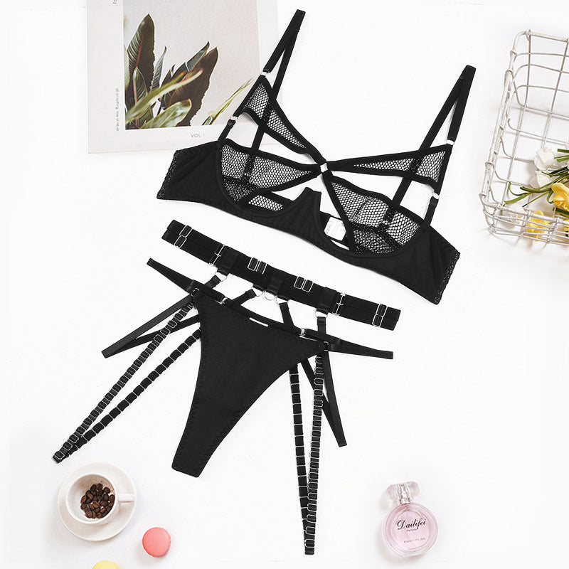 “Close-up of mesh fabric and steel ring gathering on three-piece lingerie set”