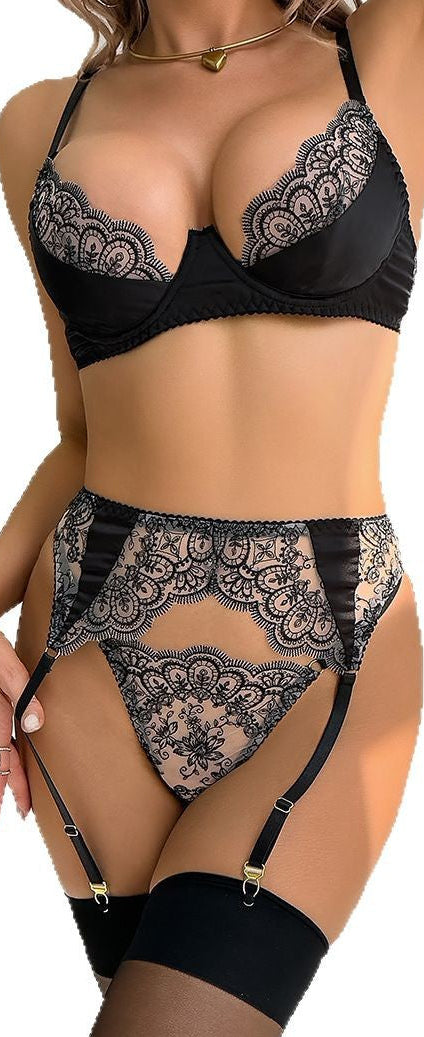 “Front view of embroidered lace hollow out three-piece lingerie with silk stockings”