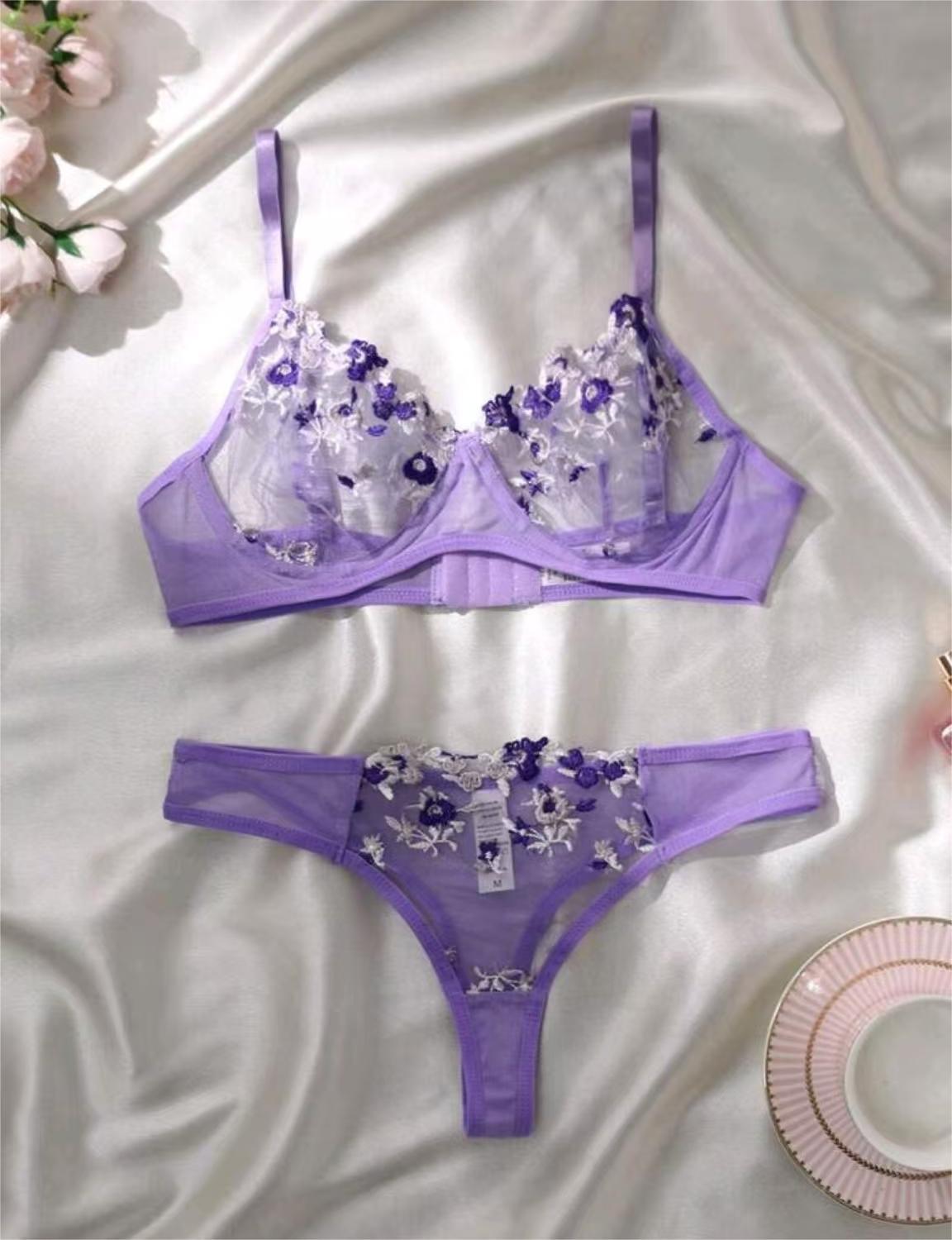 Sheer floral bralette with adjustable straps on mannequin