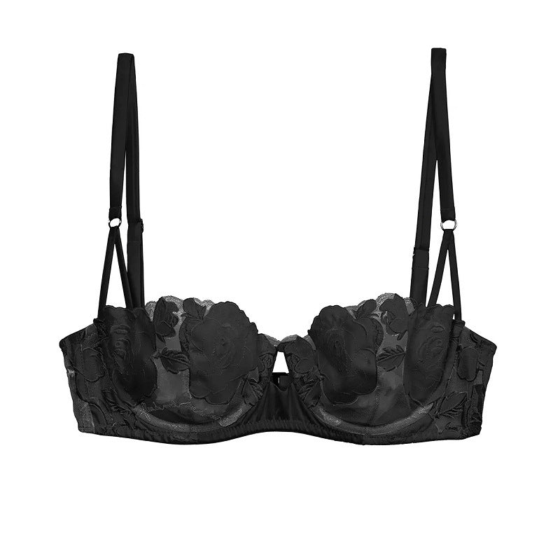 Black bra with floral lace details on a white background