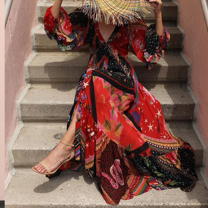 Person wearing a colorful patterned dress sitting on stone steps.