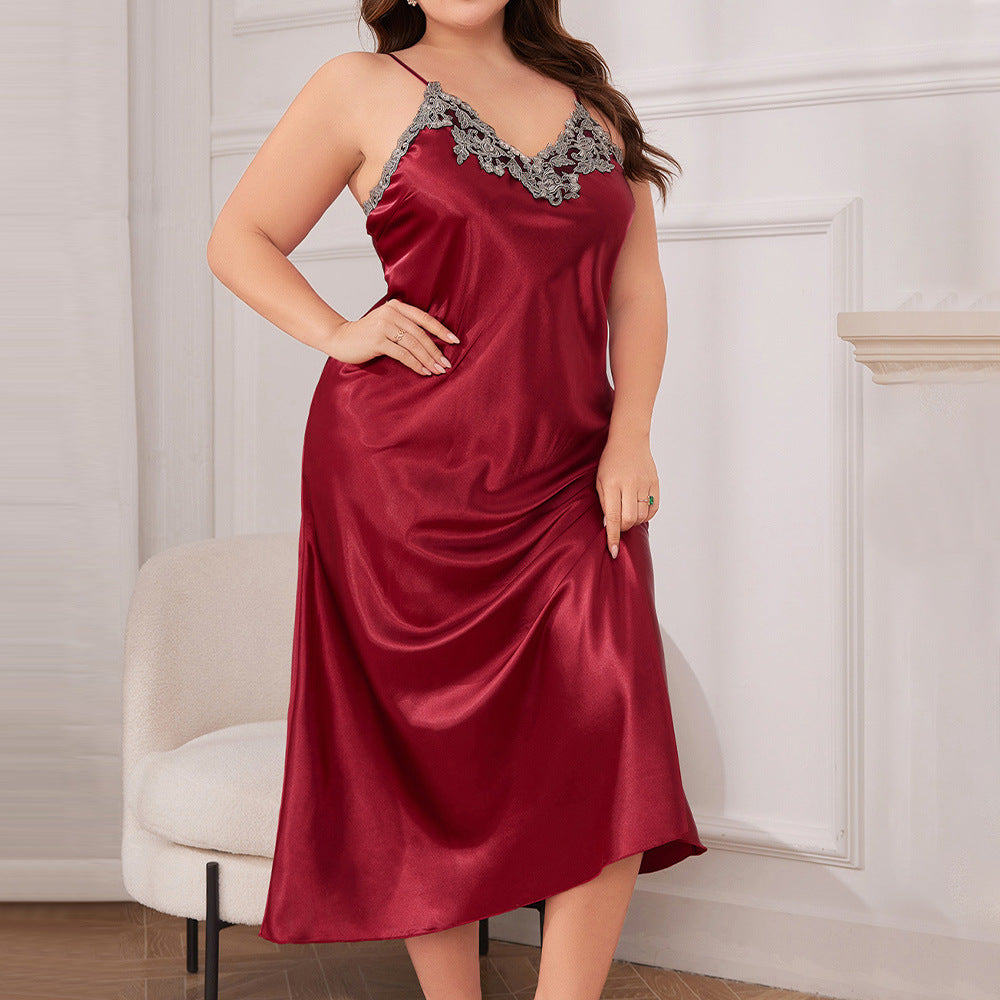 Woman wearing a red satin nightgown with lace details in a room.