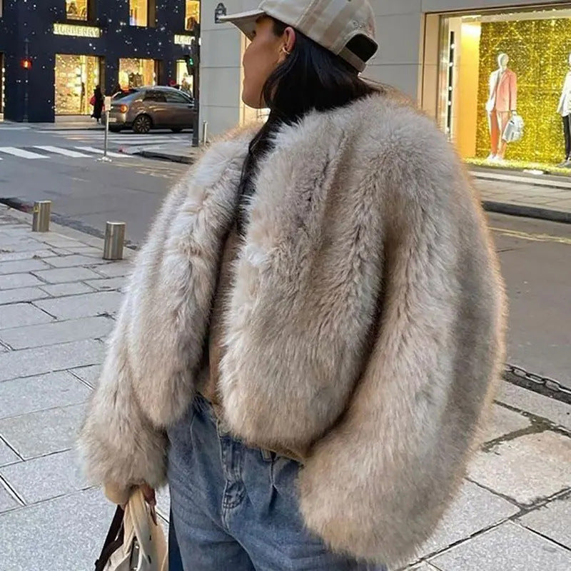 Person wearing a fluffy beige coat on a city street
