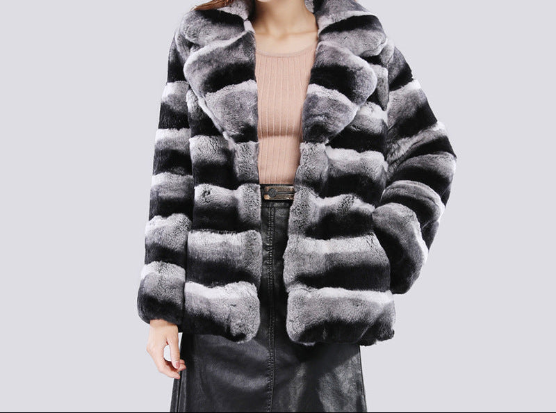 Close-up of soft plush faux mink fur on plus size short jacket