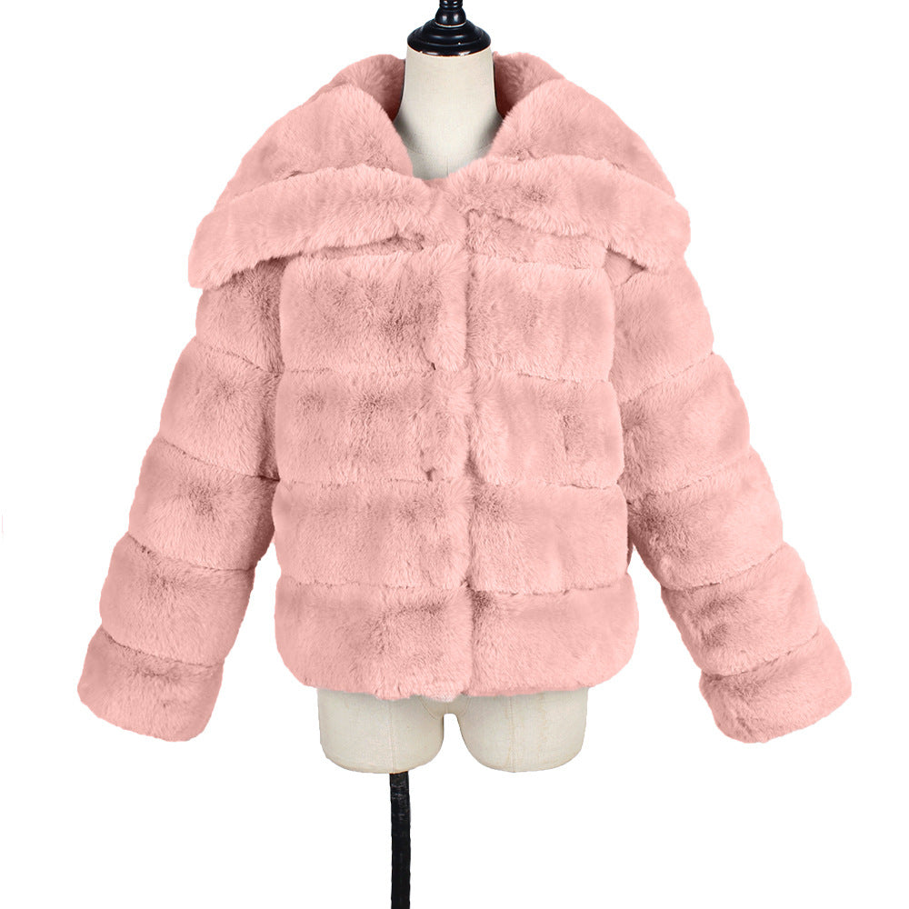 Pink faux fur jacket on a mannequin against a white background
