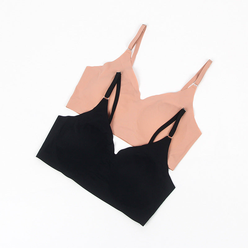 Black and beige bras on a white background