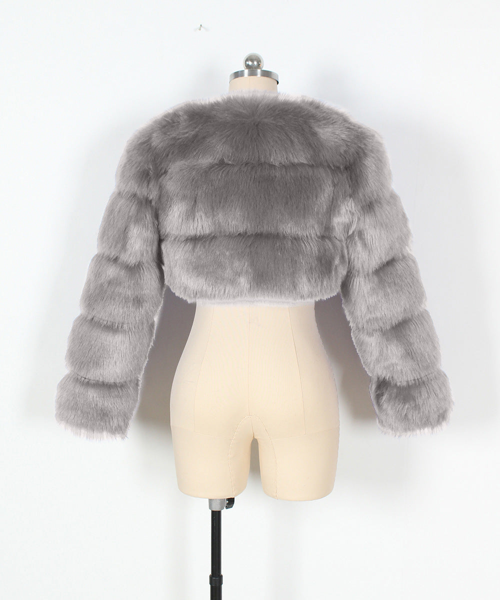 Gray fur jacket on a mannequin against a white background