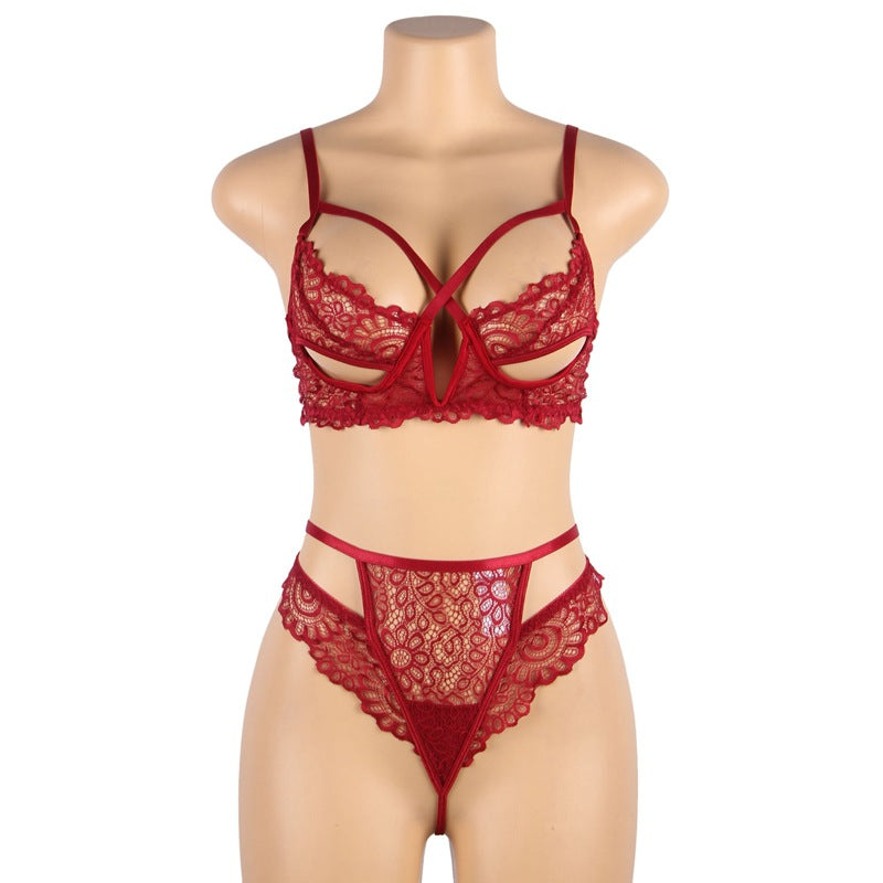 Red lace lingerie set on a mannequin against a white background