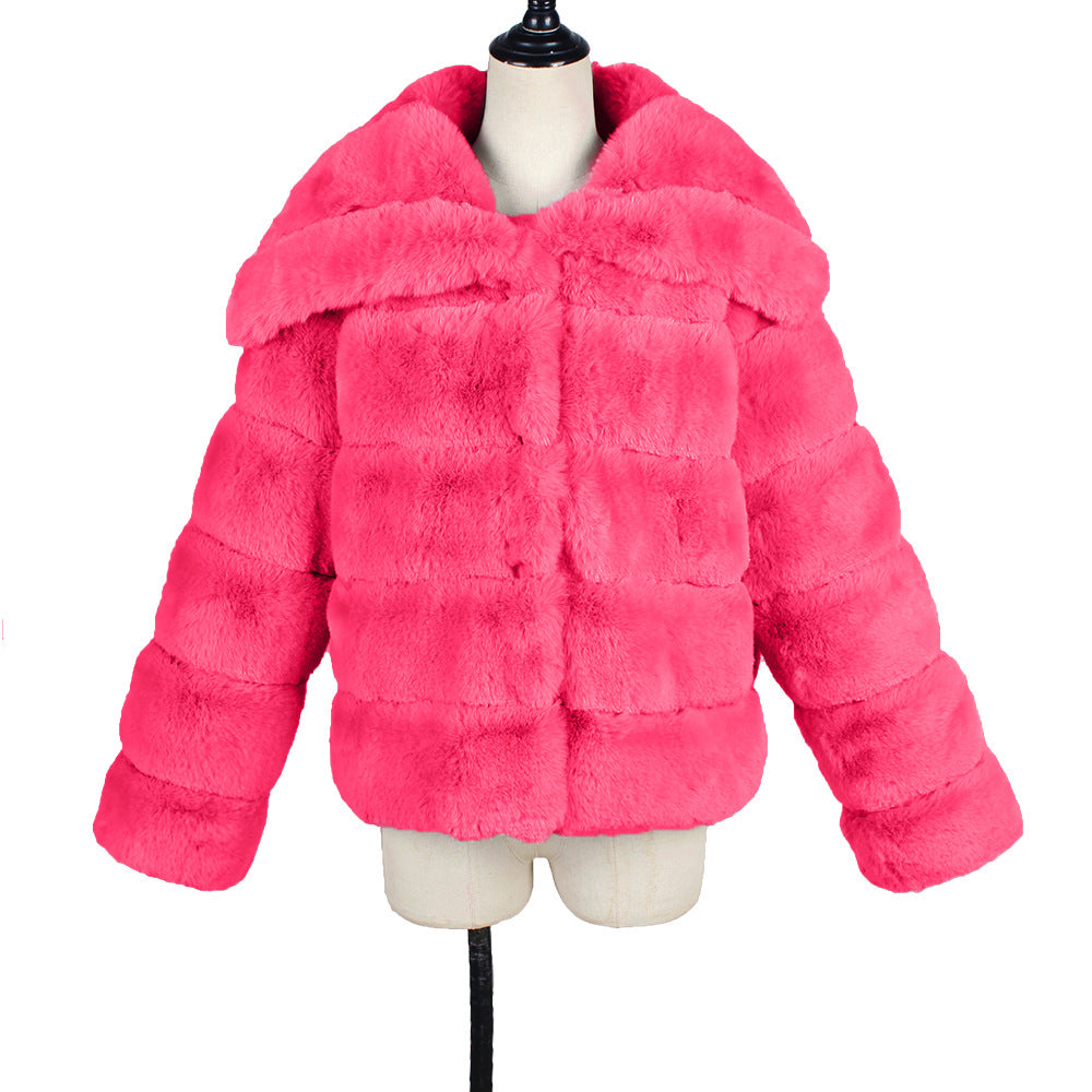 Pink faux fur jacket on a mannequin against a white background