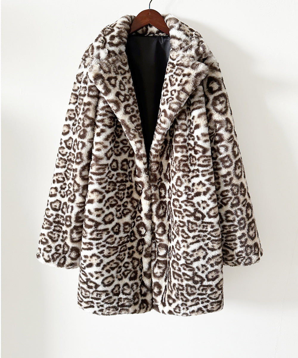 Leopard print coat on a hanger against a white background