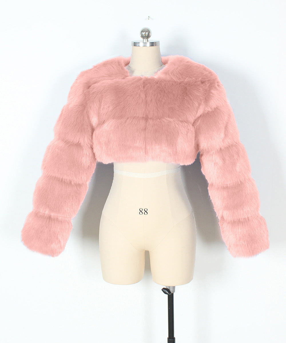 Pink faux fur jacket on a mannequin against a white background