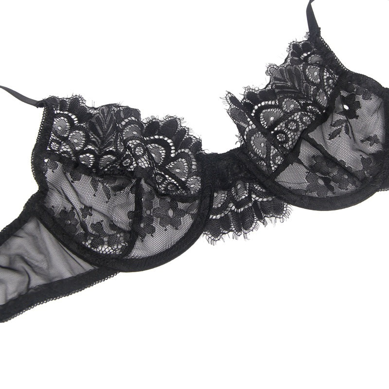 Black lace lingerie set on a white background