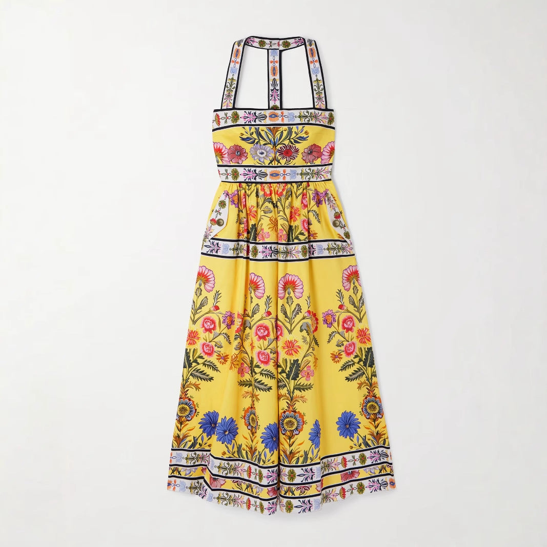 Yellow floral dress with a colorful pattern on a white background