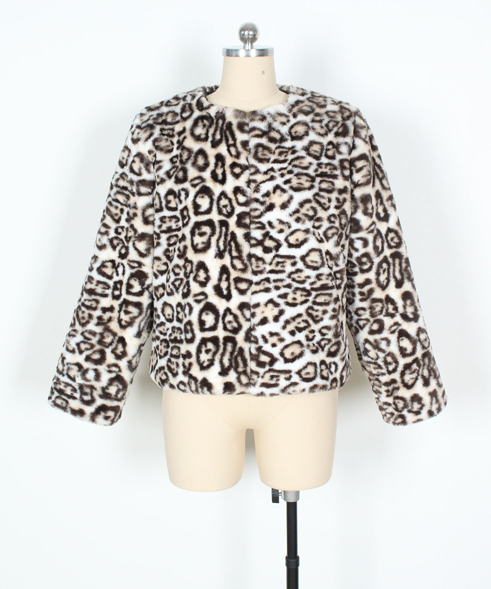 Leopard print sweater on a mannequin against a white background