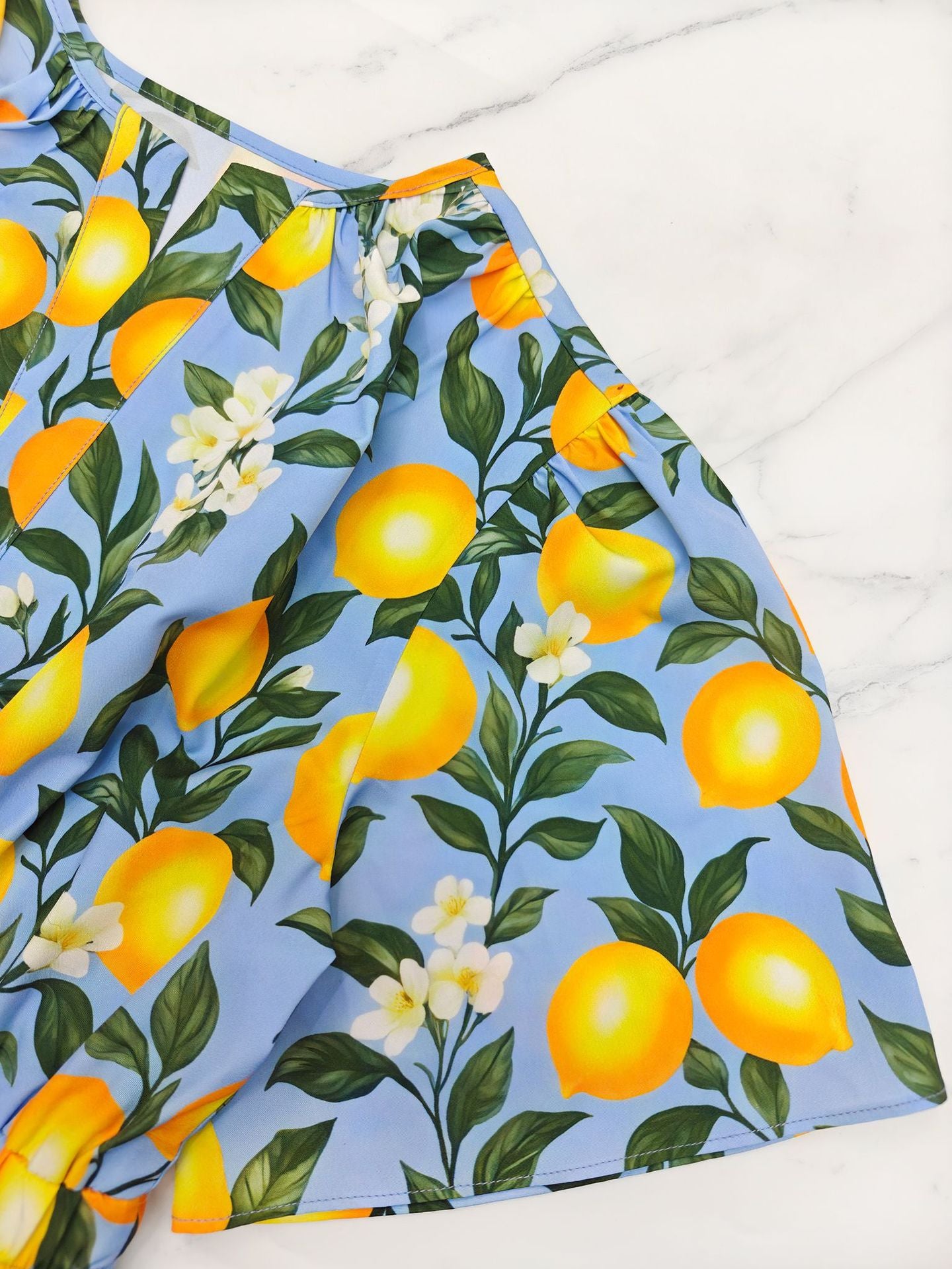 Skirt with lemon and floral pattern on a blue background