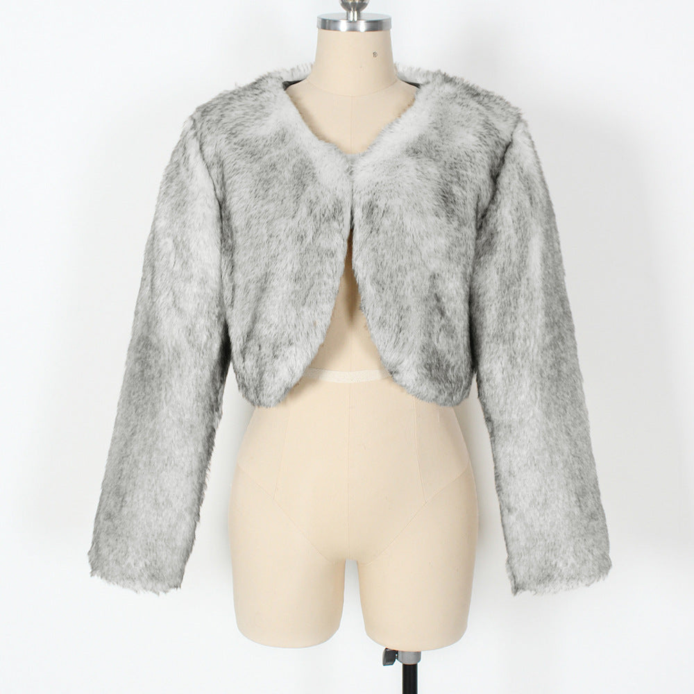 Gray fur bolero jacket on a mannequin against a white background