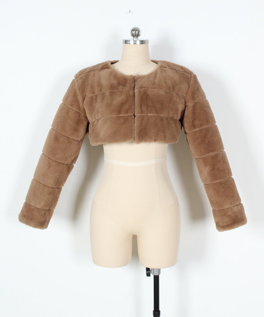 Brown fur jacket on a mannequin against a white background