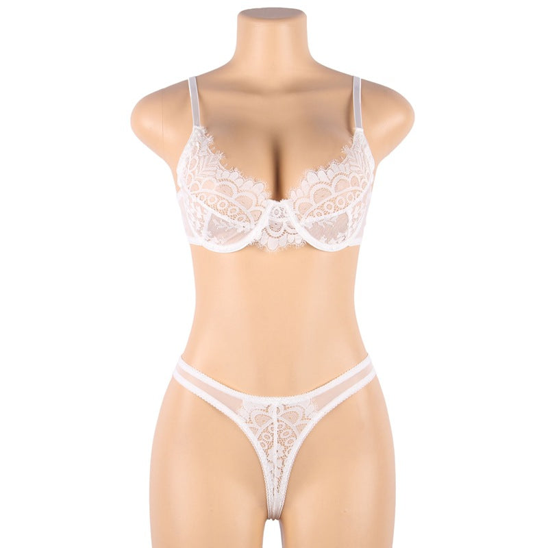 White lace lingerie set on a mannequin against a white background