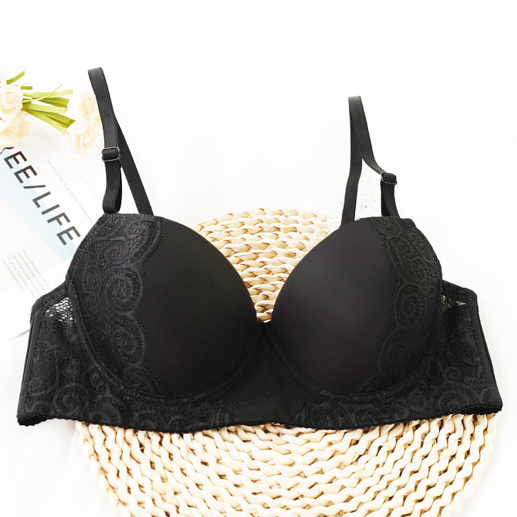 Black bra with lace details on a white background