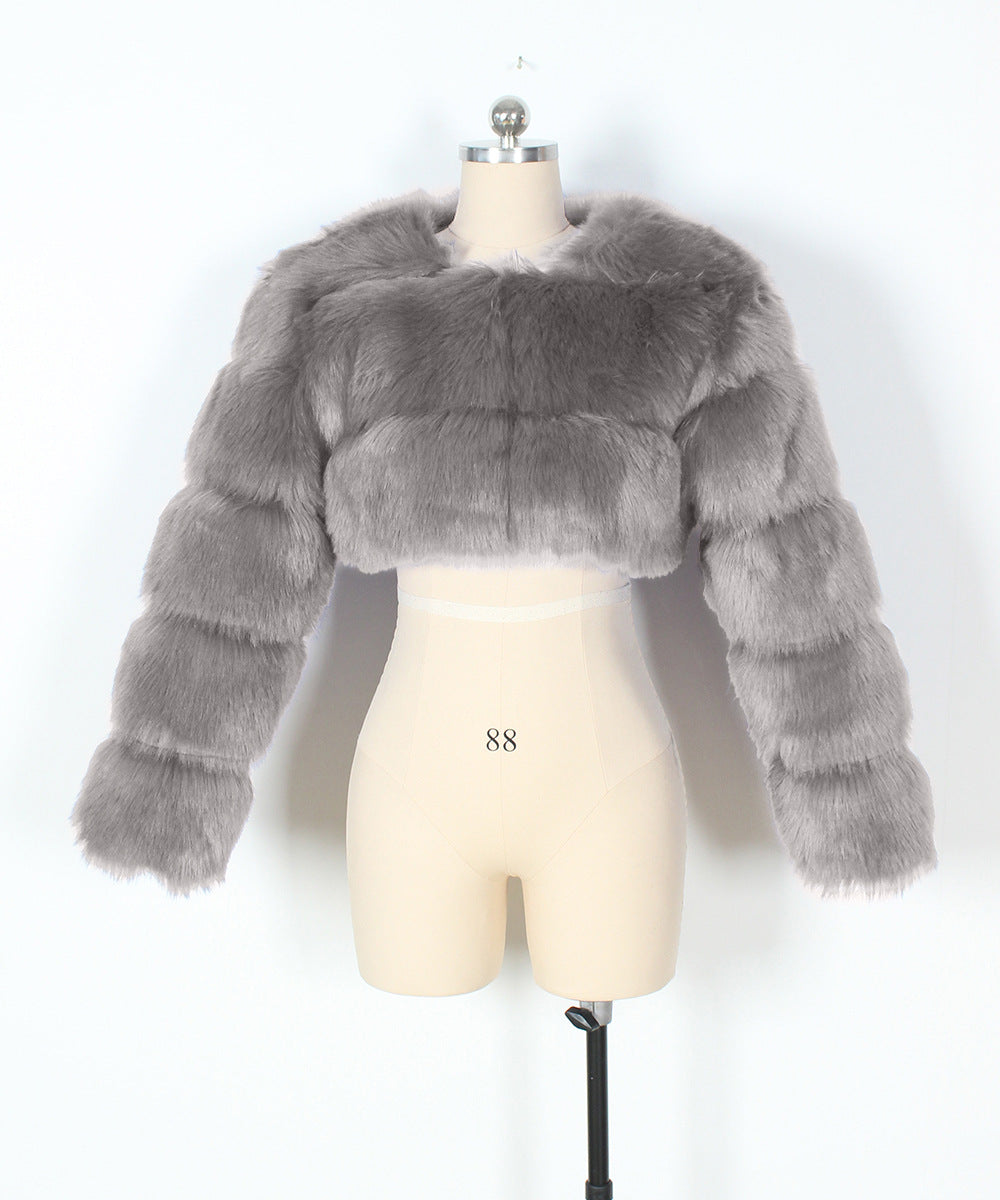 Gray fur jacket on a mannequin against a white background