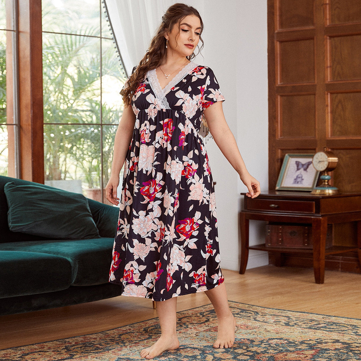 Woman wearing a floral dress in a living room setting