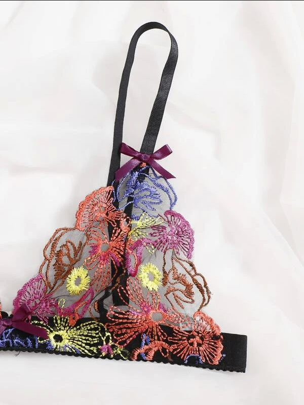 Colorful embroidered bralette with floral patterns on a white background