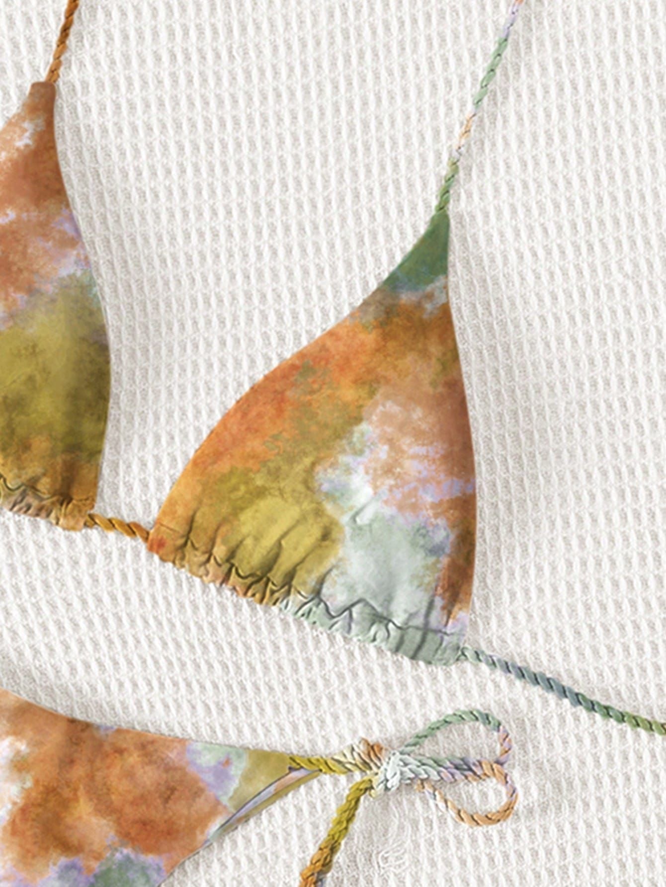 Close-up of a colorful bikini top with a white background