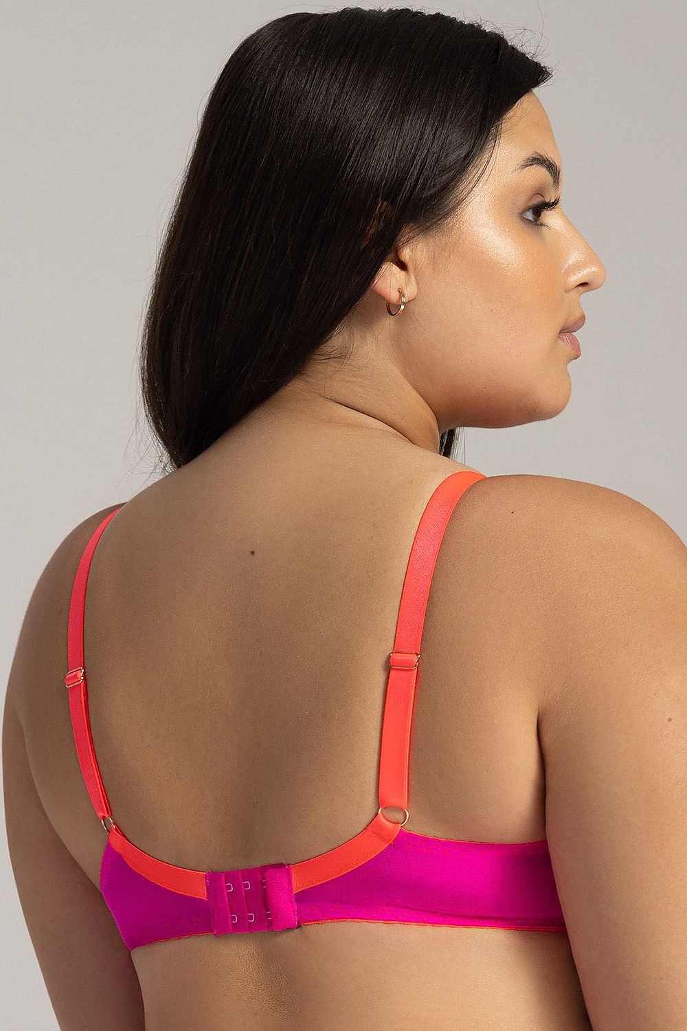 “Back view of soft bra with adjustable straps and secure hook closure”