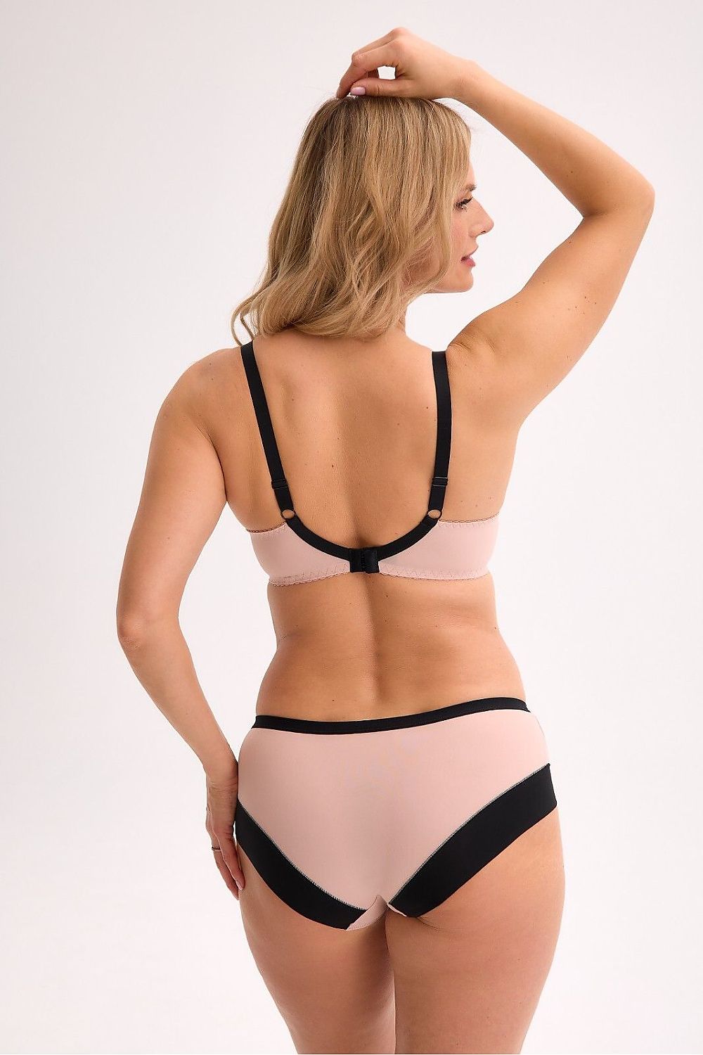 “Back view of semi-rigid bra with adjustable hook-and-eye closure and stylish straps”