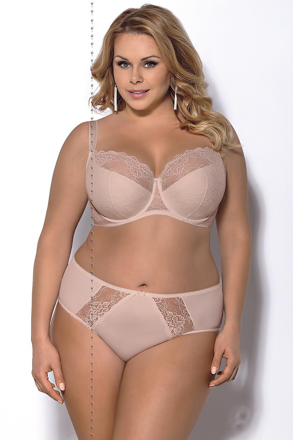 “Side view showing inward lift and rounded shape of breasts in lace bra”