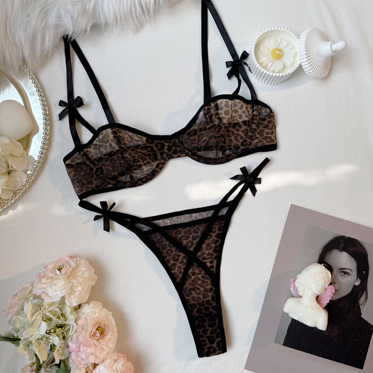 “Close-up of leopard print detailing and French bra design on erotic lingerie set”