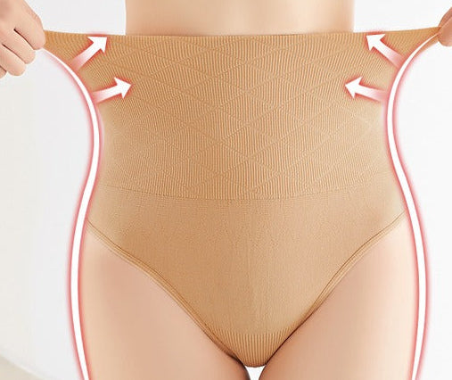 Curvy woman wearing waist cinching and hip lifting seamless pants